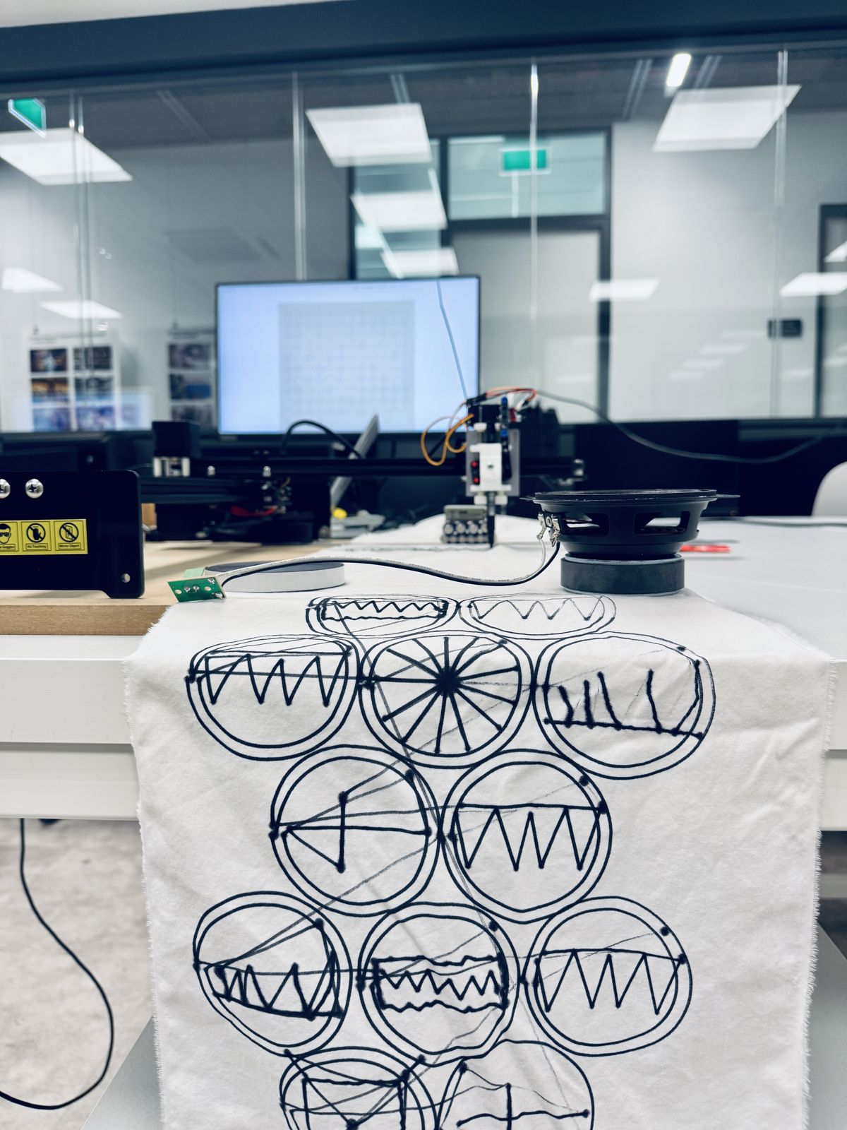 The plotter above a full stretch of cloth